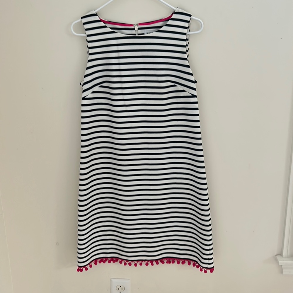 Navy and white striped shift with hot pink pompon fringe along hem